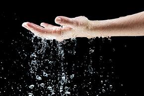Water Falling on Hand